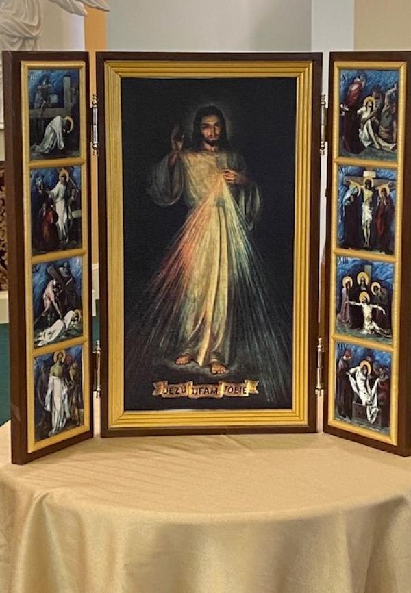 A wonderful story was shared about the purchase of the Divine Mercy tri-fold Deacon Ges and Loretta Schneider displayed on the altar.